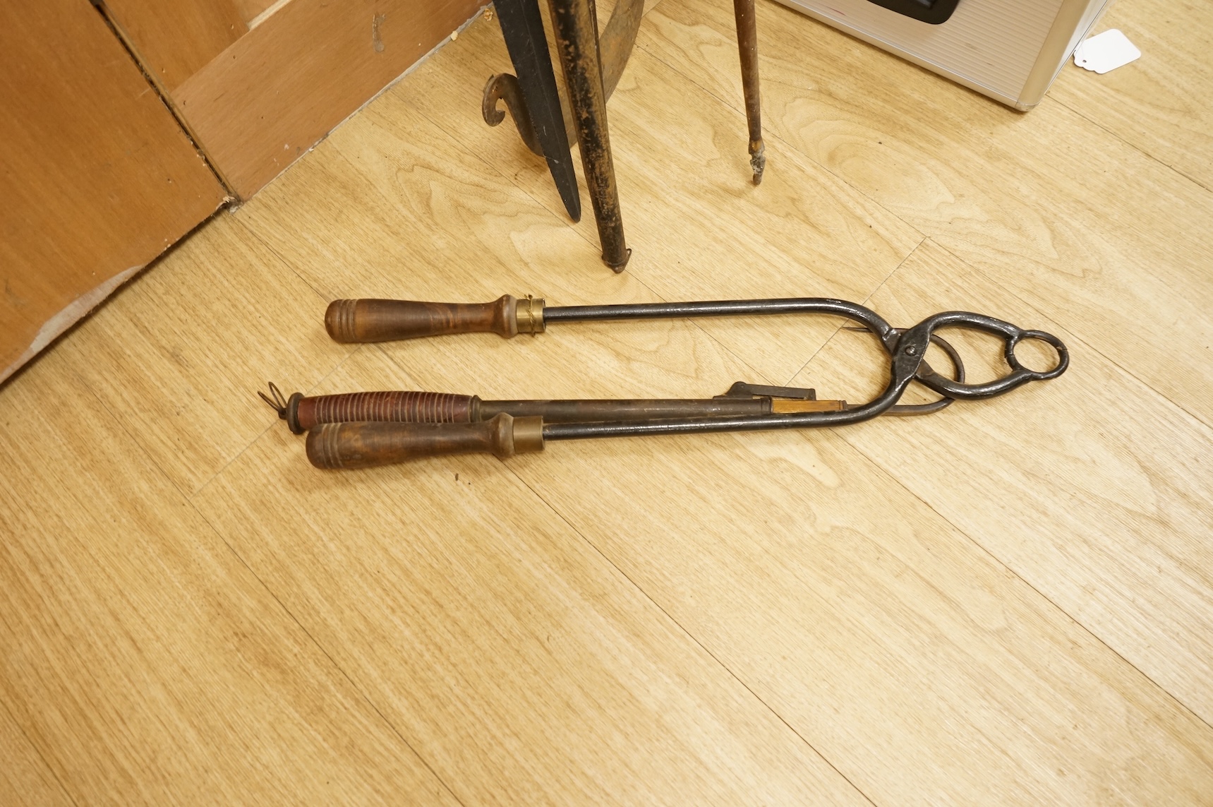 A collection of tribal spears, a fish hook, a cased snooker cue, etc.